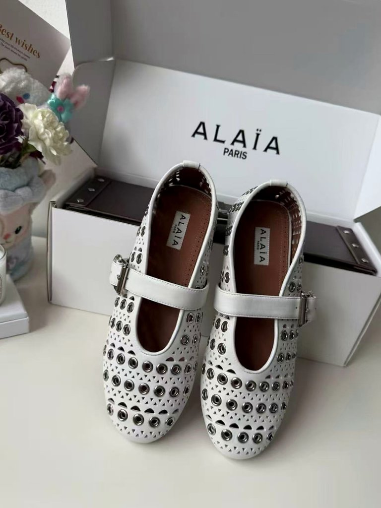 Alaia Perforated Leather Adjustable Buckle Flat Shoes